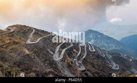 Three Level Zigzag road is probably the most dizzying road in the world. Located in the Sikkim Indian state, in the Himalayan mountains, the road incl Stock Photo