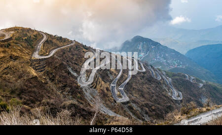 Three Level Zigzag road is probably the most dizzying road in the world. Located in the Sikkim Indian state, in the Himalayan mountains, the road incl Stock Photo