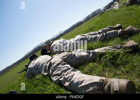 Scout Snipers with 2/24 Battalion, 23rd Marine Regiment, 4th Marine Division, Marine Forces Reserve, finish their qualifications on the range during a fire support coordination exercise in Camp Atterbury, Ind.,  April 14, 2016. Along with completing their qualifications the Marines worked with Company B, 8th Battalion, 229th Aviation Regiment (8-229 AV), 11th Aviation Command (Theater), a U.S. Army Blackhawk crew, to hone their skills in casualty evacuations and insertion exercises into enemy lines. Stock Photo