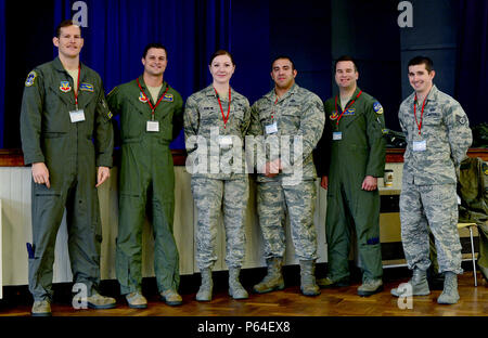 Airmen assigned to the 95th Fighter Squadron at Tyndall Air Force Base, Fla., pose for a group photo at IES Breckland in Brandon, England, April 26. The Airmen from the 95th FS are temporarily deployed to Royal Air Force Lakenheath, England. During their visit to the U.K., the Airmen engaged with the local community to educate them about the U.S. Air Force mission, as well as the importance of training with host nation allies. (U.S. Air Force photo/Senior Airman Erin Trower) Stock Photo