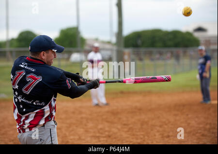 A member of the 45th Intelligence Squadron Dream Crushers team hits a  softball during the 2nd Annual Kings of the Bay Softball Tournament at  Langley Air Force Base, Va., April 30, 2016.