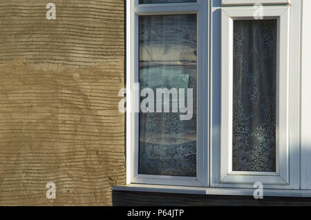 Facade repair on residential dwellings after pebble dash has been removed Stock Photo