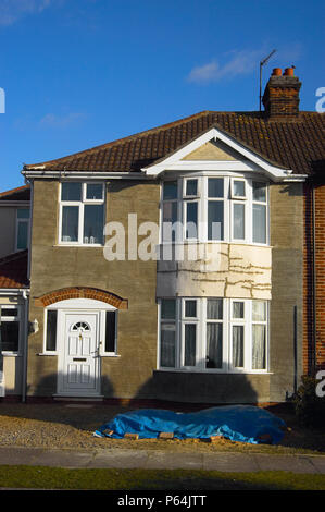 Facade repair on residential dwellings after pebble dash has been removed Stock Photo