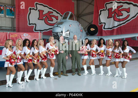 Col. Greg Eckfeld (left) and Col. Brian Borgen, vice commander and commander of the 442d Fighter Wing respectively, meet with the Kansas City Chiefs cheerleaders during the Military Appreciation Day event at Whiteman Air Force Base, Mo., April 30, 2016. Service members and their families enjoyed photo-ops and autographs with the Chiefs cheerleaders and players, among other activities. (U.S. Air Force photo by Airman 1st Class Missy Sterling/Released) Stock Photo
