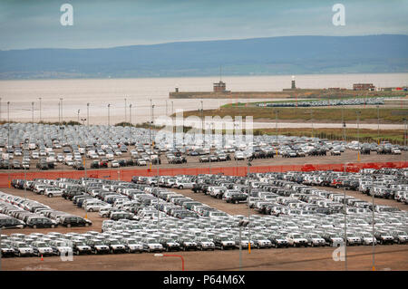 New Suzuki cars and vans parked at Avonmouth docks near Bristol, UK Stock Photo