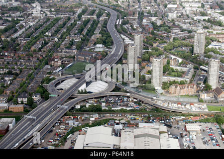 Aerial view north east of Westway Sports Centre, A40, West Cross Route, industrial buildings, residential buildings in London, North Kensington, White Stock Photo