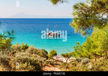 POTOS, THASSOS GREECE, 03 SEPTEMBER 2016 Small beach Potos in Greek island Thassos, with boat on sea on 03 september on Thassos Stock Photo