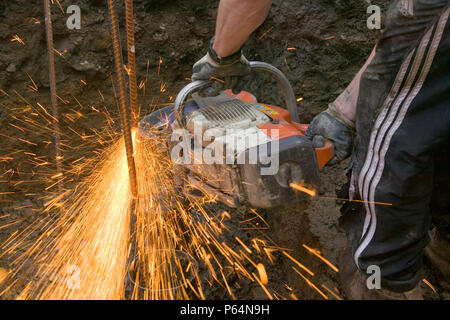 Builder using an angle grinder Stock Photo