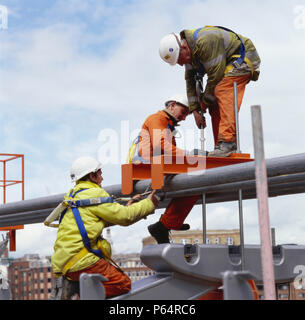 Construction engineers working on the Millennium Bridge, London, UK Stock Photo