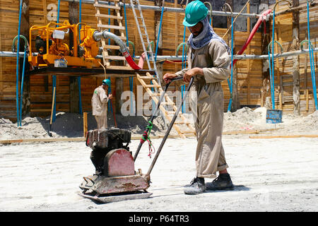 Construction worker preparing foundations, Abu Dhabi Stock Photo