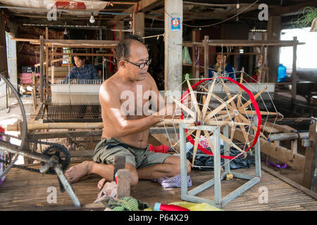 a silk weaving factory at the silk Island or Koh Dach near the city of Phnom Penh of Cambodia.  Cambodia, Phnom Penh, November, 2017, Stock Photo