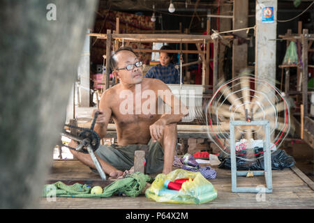 a silk weaving factory at the silk Island or Koh Dach near the city of Phnom Penh of Cambodia.  Cambodia, Phnom Penh, November, 2017, Stock Photo