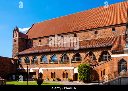 Olsztyn, Warmian-Masurian / Poland - 2018/06/16: Main wing and inner courtyard of the Warmian Bishops Castle in historical quarter of Olsztyn old town Stock Photo