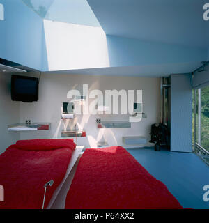 Metal boxes attached to the wall in an eclectic bedroom Stock Photo