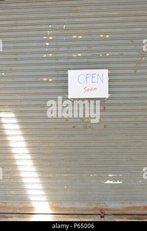 Louver Area. Sign paper sign on iron louver door Stock Photo - Alamy