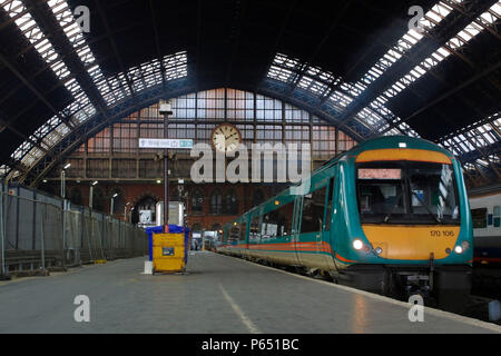 A Midland Mainline Turbostar train awaits departure from London's St Pancras Station. The impressive Barlow's Arch is seen looming overhead. 8th April Stock Photo