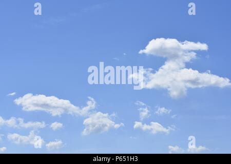 Blue sky with white clouds in different dreamy shapes Stock Photo