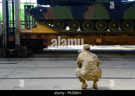 U.S. Army soldiers of 64th Armored Cavalry Regiment distribute soccer ...