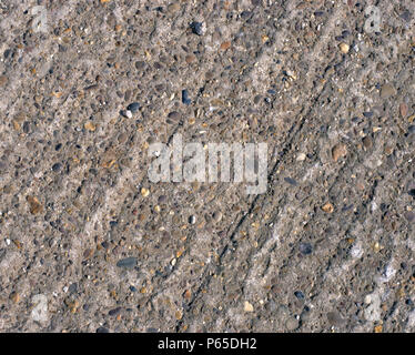 Detail of screeded concrete slab showing exposed aggregate. Stock Photo