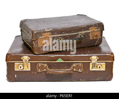 Old suitcases, travel items, luggage or baggage. Vintage suitcases, retro, leather suitcases, isolated on white background. Stock Photo