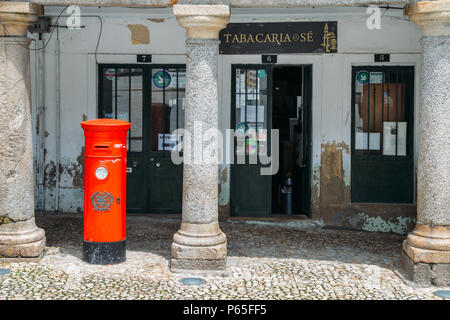 British-style postbox in front of a tobacco shop in Guarda, Portugal Stock Photo