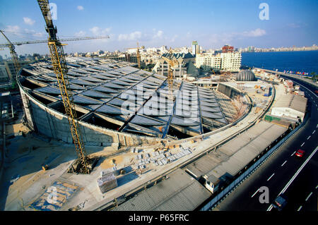 Work underway on the unusual sloping roof cylinder of the modern Alexandria Library in Egypt (replacing the library of antiquity) World Heritage proje Stock Photo