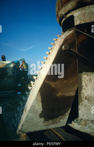 Welder working on site during piling operations, USA. Stock Photo