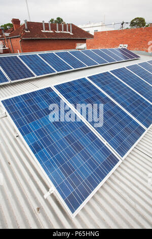 Solar panels on the roof of the Super AIG Supermarket, on Glenferries road in Hawthorn, Melbourne, Victoria, Australia, provide the power for the stor Stock Photo