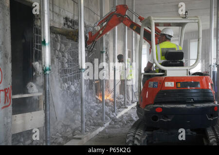 Vehicle using hydraulic hammer in demolition of former stock exchange, London, UK Stock Photo