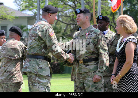 FORT SHAFTER, Hawaii—Gen. Robert B. Brown (left), commanding general, U.S. Army Pacific, presents Maj. Gen. Todd B. McCaffrey (right), the Distinguished Service Medal for meritorious service as the USARPAC Deputy Commanding General-South during a Flying 'V' ceremony held at historic Palm Circle, Fort Shafter, Hawaii, May 6. McCaffrey will depart USARPAC to assume command of First Army Division East, Fort Knox. (U.S. Army photo by, Staff Sgt. Kyle J. Richardson, USARPAC PAO) Stock Photo