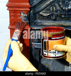Cleaning A Cast Iron Victorian Fireplace Stock Photo 210339133