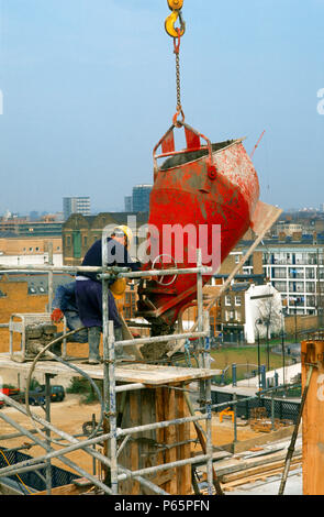 Formworking. Pouring concrete into a formwork column Stock Photo