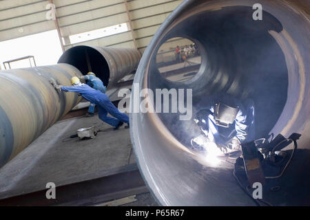 Workers at Hyojong Pipe factory, Doha. Stock Photo
