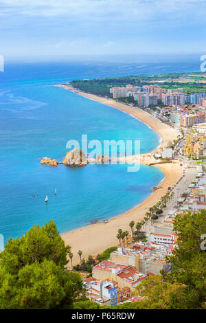 Rock Sa Palomera on coast of Spanish beach resort Blanes in summertime. Sunny view from height of mountain of castle San Juan. Costa Brava, Catalonia, Stock Photo