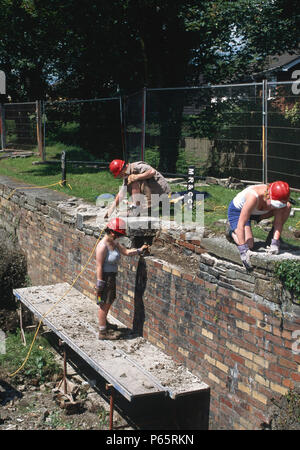 Volunteer workers restoring the Cefn Lock on the Monmouthshire and Brecon Canal. High Cross, Newport, Wales. Stock Photo