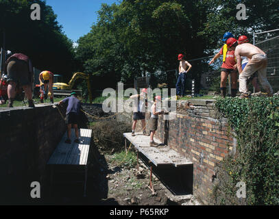 Volunteer workers restoring the Cefn Lock on the Monmouthshire and Brecon Canal. High Cross, Newport.  Wales. Stock Photo