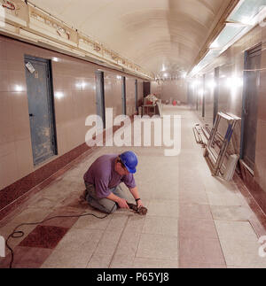 Flooring works in passenger tunnel during refurbishment of Angel Underground station. London, United Kingdom. Stock Photo