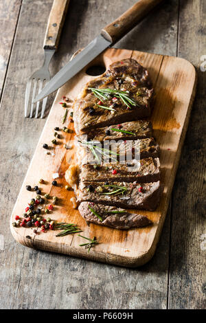 Grilled beef steak and spicy on rustic wooden background Stock Photo