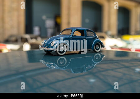 BERLIN - MAY 06, 2018: Toy model of the popular car VW Beetle. Exhibition 31. Oldtimertage Berlin-Brandenburg (31th Berlin-Brandenburg Oldtimer Day). Stock Photo