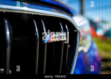 Exterior detail of the mid-size luxury car BMW M5 Limousine (F90). Close-up. Stock Photo