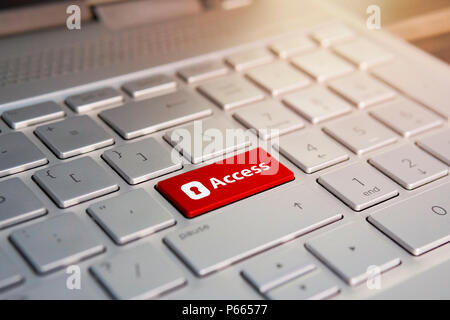 access enter key and keys icon. Color button on the gray silver keyboard of modern ultrabook. caption on the button Stock Photo