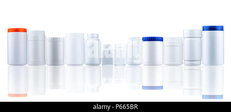 Plastic drug bottle container with closed cap. Pharmaceutical industry packaging. Many of medicine bottle with different size and shape with blank lab Stock Photo