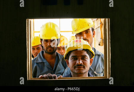 Construction workers on a new sky scrapper Stock Photo