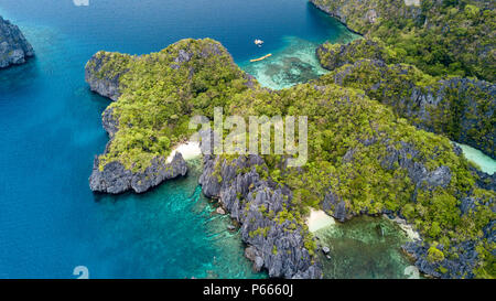 Aerial drone view of a spectacular tropical lagoon with small beaches and jagged cliffs Stock Photo