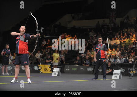 Nicolas Meunier of Team Canada, right, and Gareth Paterson of Team United Kingdom, compete during the archery finals of the 2016 Invictus Games at the ESPN Wide World of Sports Complex, Orlando, Fla., May 9, 2016. The Invictus Games are an adaptive sports competition which was created by Prince Harry of the United Kingdom after he was inspired by the DoD Warrior Games. This event brings together wounded, ill, and injured service members and veterans from 15 nations for events including: archery, cycling, indoor rowing, powerlifting, sitting volleyball, swimming, track and field, wheelchair bas Stock Photo