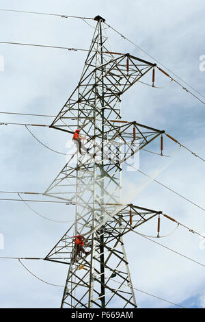 Workers Cleaning High Voltage Towers On The Way To Escondida, Chile Stock Photo