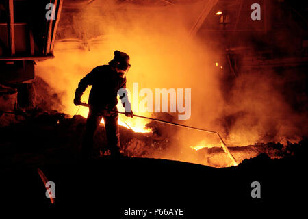 Team member taking iron samples on Blast Furnace No 5 at Corus Port Talbot steelworks, Neath, JM1. Stock Photo