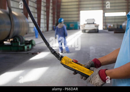 Workers at Hyojong Pipe factory, Doha. Stock Photo