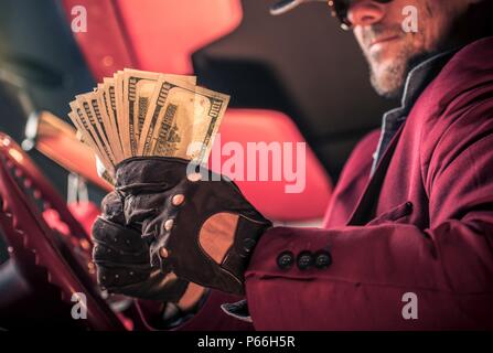 Men with Bunch of Cash Dollars Money. Easily Gained Money in the Casino. Pure Gravy. Stock Photo