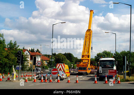 Mobile crane blocking access to road, Manchester, UK. Stock Photo